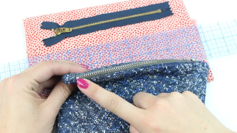 Showing the neat zip placement on a quilted wash bag.