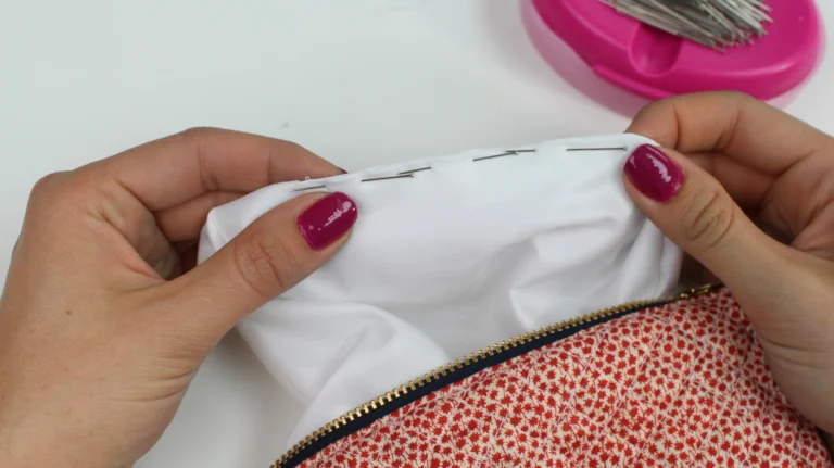 Pinning the lining opening ready to close inside a quilted wash bag.