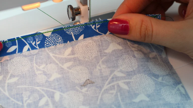 Sewn second stitch of a rolled hem, with the fold stitched