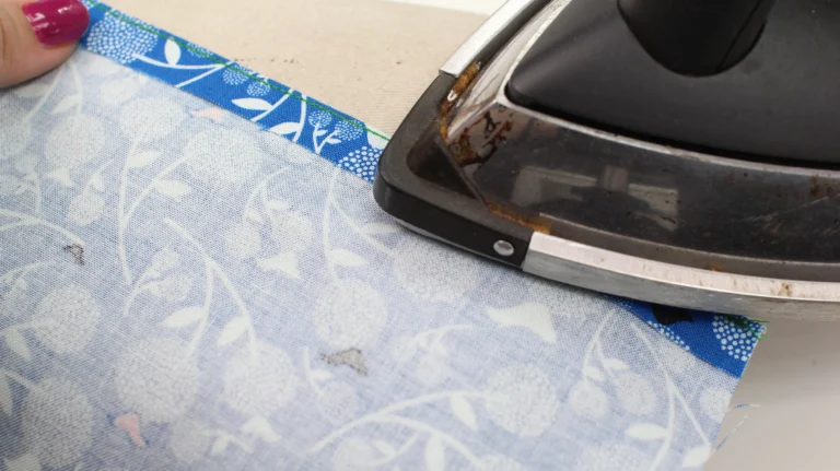Press the second stitch of the rolled hem