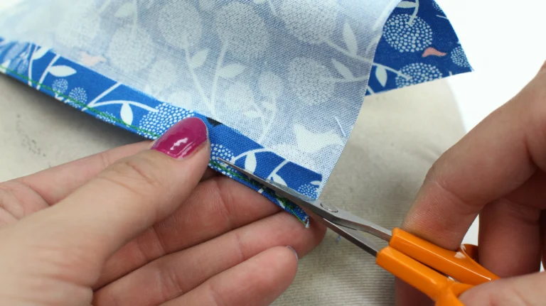 Trim the rolled hem seam allowance