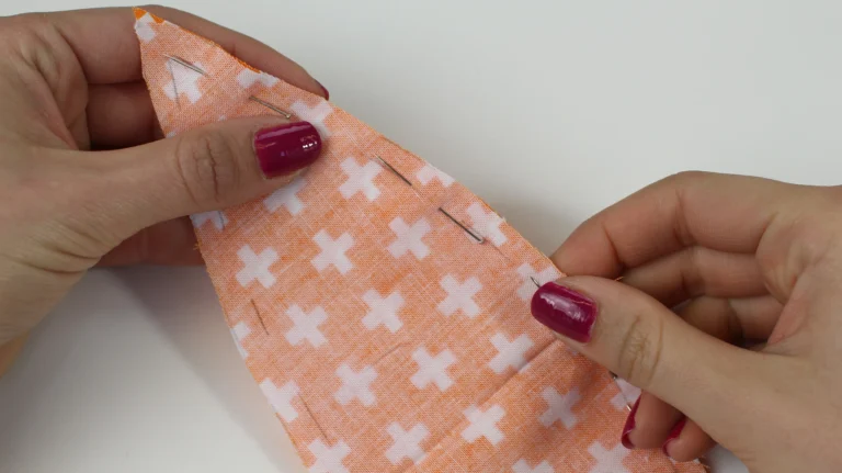Pin the stitching line of the pumpkin segment template together