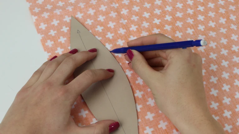 Draw around the pumpkin segment template on the wrong side of the fabric
