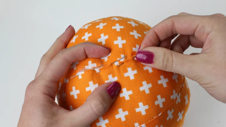 Pin the seam allowances of the pumpkin at the opening