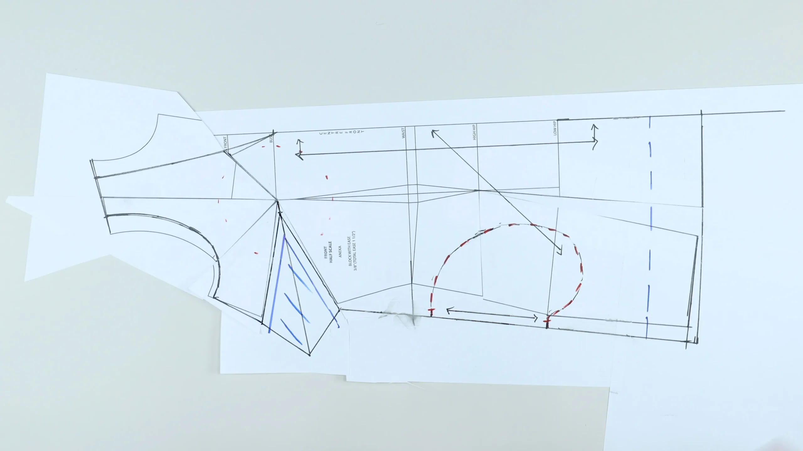 Marking grainline references on the front dress pattern.