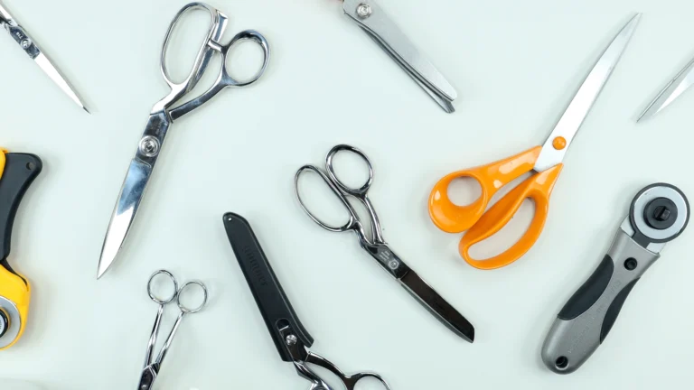 Collection of dressmaking scissors including Fiskars orange handle scissors - essential sewing tools