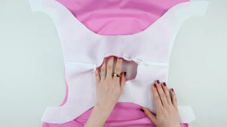 Pinned neckline of an all-in-one facing and bodice cut on the fold at the centre back