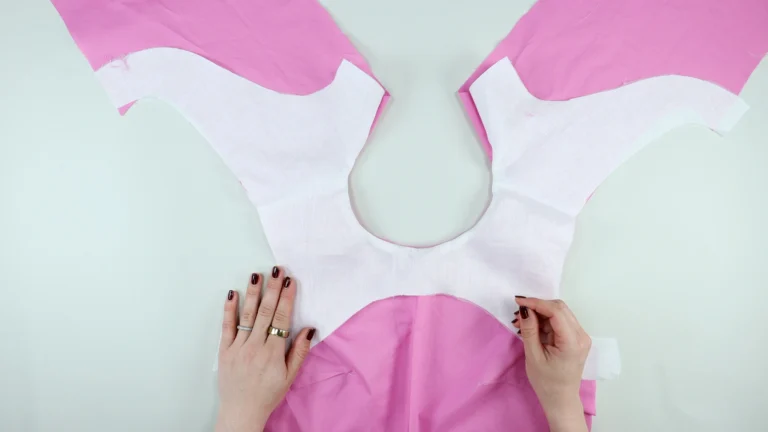 Sewn neckline right side facing out, of the facing and bodice