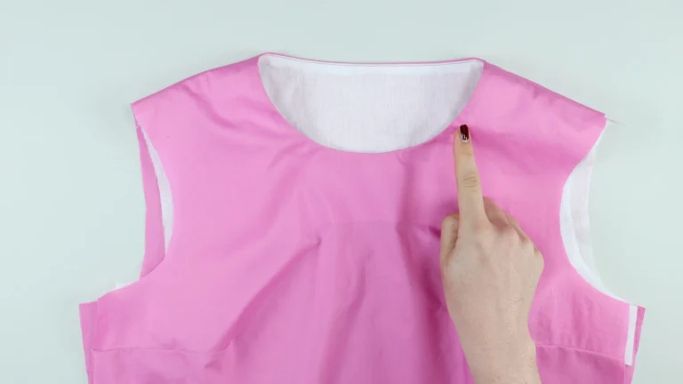 Understitched neckline on a bodice without a centre back seam, and an all-in-one facing