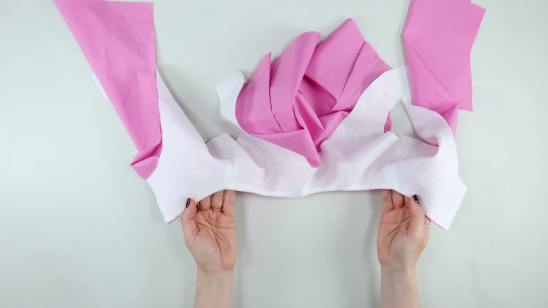 Finished understitched neckline shown from the facing side, attaching an all-in-one facing and bodice