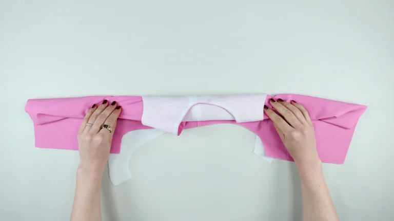 Position the rolled garment in the middle of the shoulder for the all-in-one facing with centre back on fold