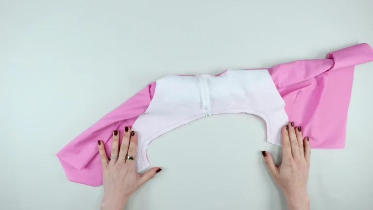 Sewn armhole with all-in-one facing and no centre back seam