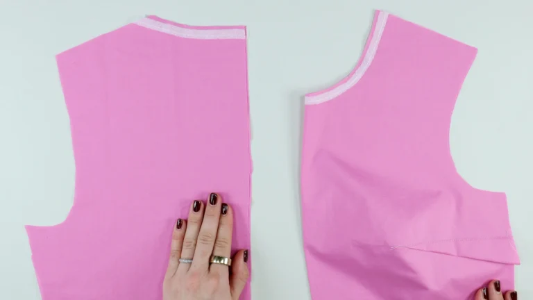 Front and back bodice pieces with stay tape applied to the neckline before sewing an all-in-one facing