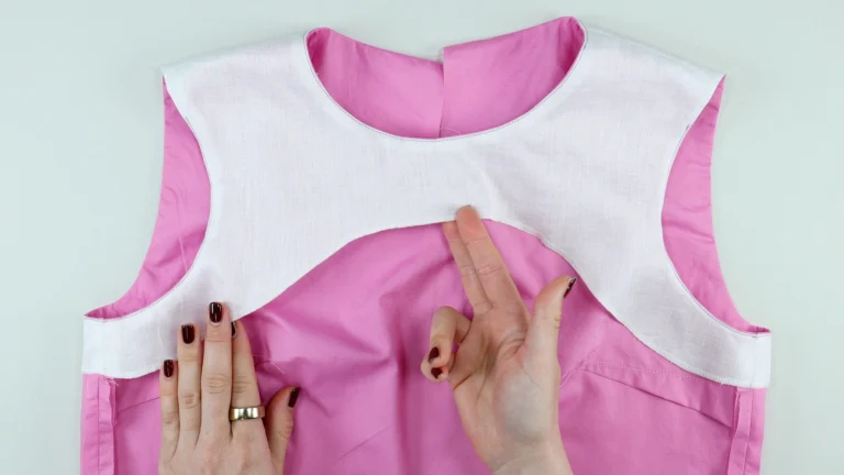 Finished bottom edge of facing with overlocking or serging for all-in-one facing