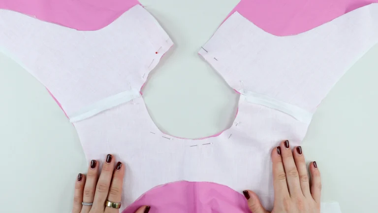 Pinned neckline of the garment, attaching the facing and bodice together