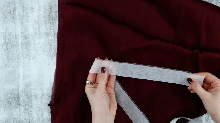 Ban-Rol interfacing on a reel showing the warp and weft thread structure used for hemming