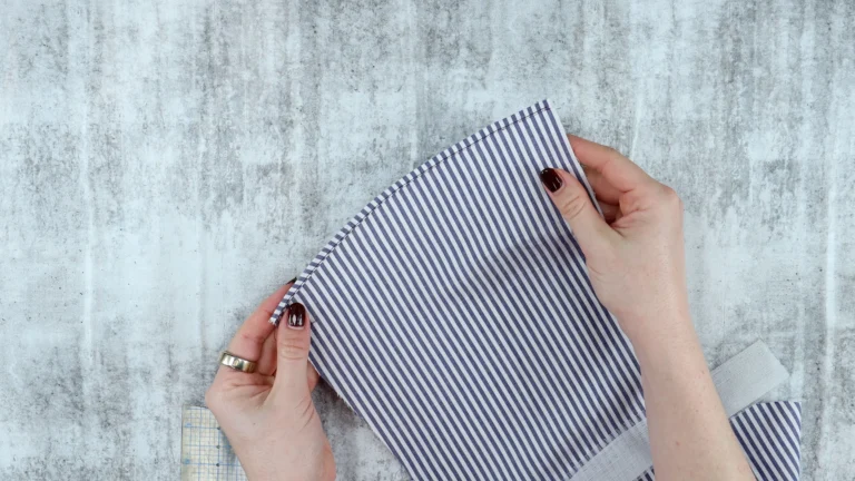 Ban-Rol hemming technique applied to cotton shirting showing a neat curved shirt hem