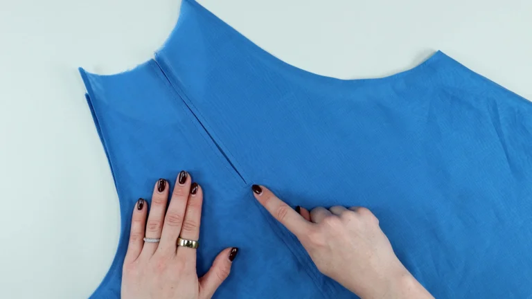 Sewn and topstitched centre back of the tie neck halterneck top