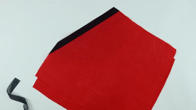 Fusible interfacing positioned onto the wrong side of the pocket slanted opening