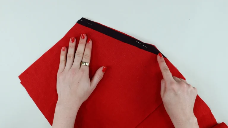 Pinned pocket back to trouser front along angled opening