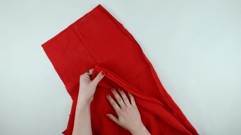 Sewn side seam of trousers, front to back