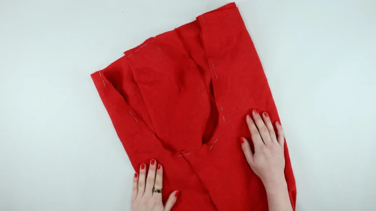 Pinned crotch seam of the trousers, one leg inside the other