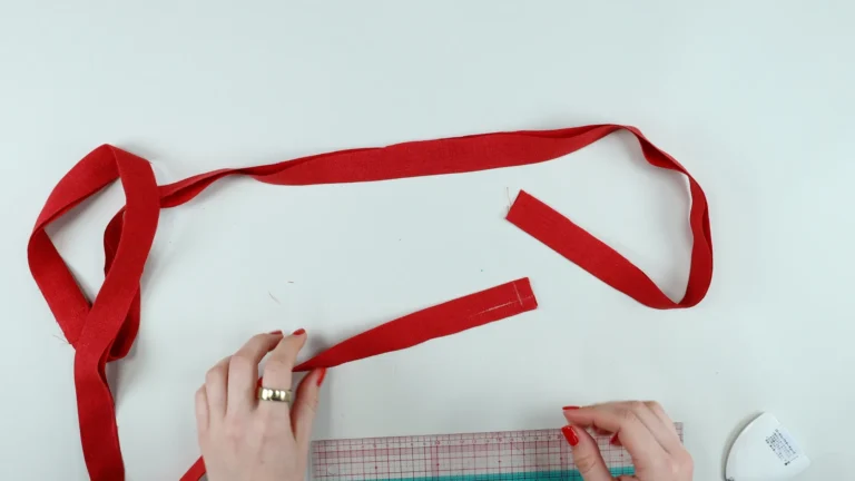 Marked corner of the tie with chalk, for sewing accurately