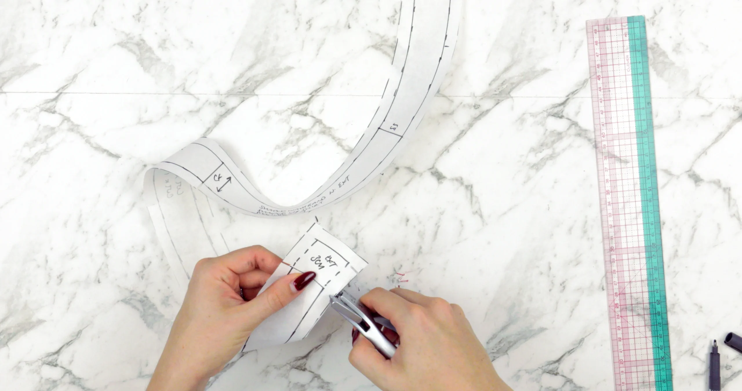 Using a pattern notcher to finish a shaped waistband for a skirt block