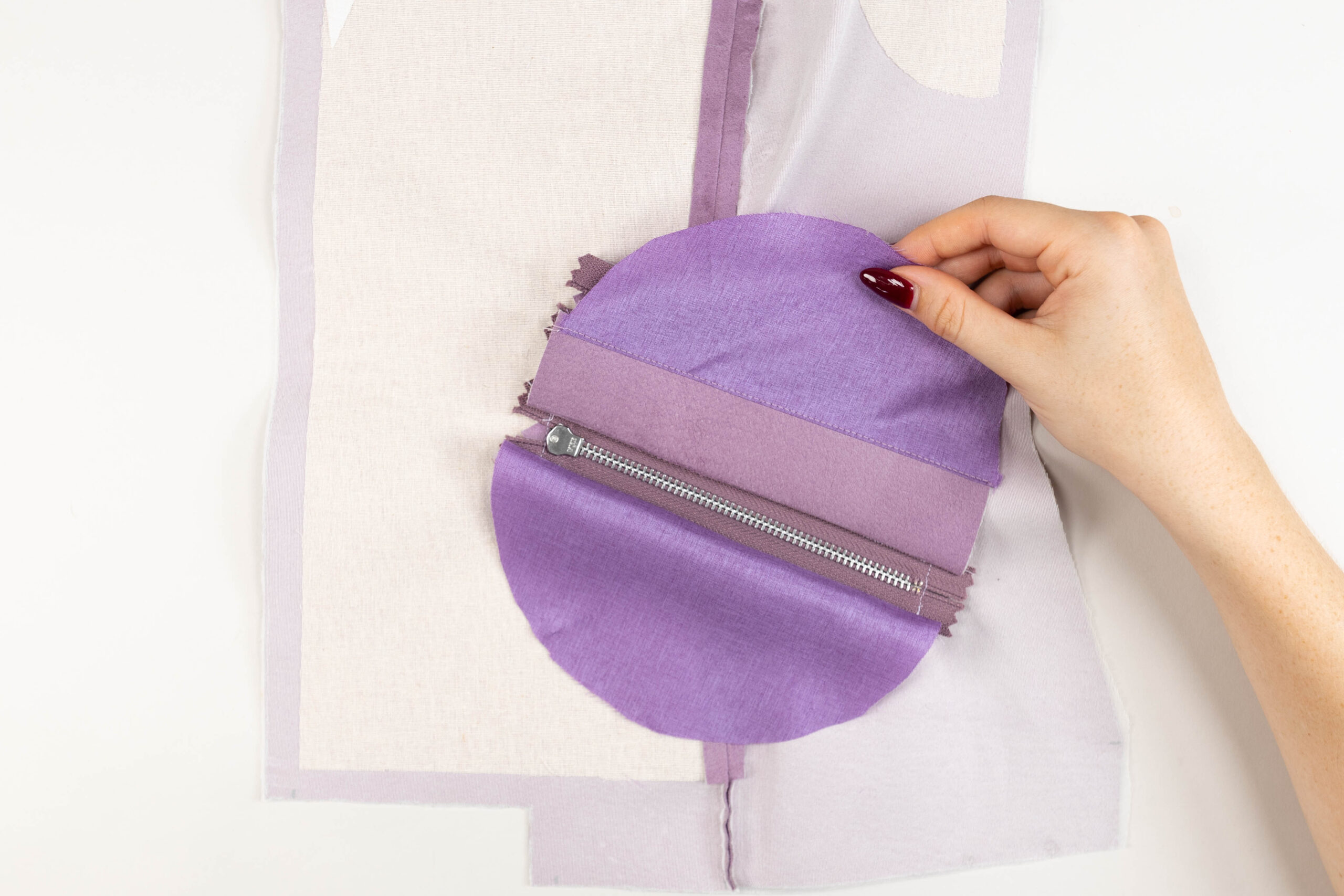 Attaching pocket bags to the back of the zip welt pockets in Paxton leather jacket class